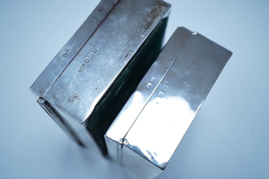 Three assorted George V/George VI silver mounted cigarette boxes, including two with engine tuned covers, the largest by Joseph Gloster Ltd, Birmingham, 1946, 12.8cm.